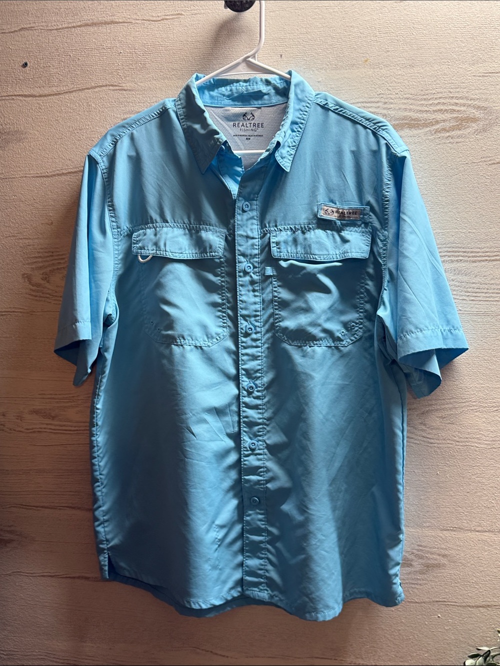 RealTree Fishing. Turquoise blue button down shirt two front pockets size M